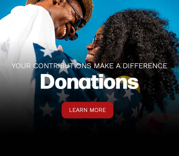 photo of an african american family draped in the american flag
